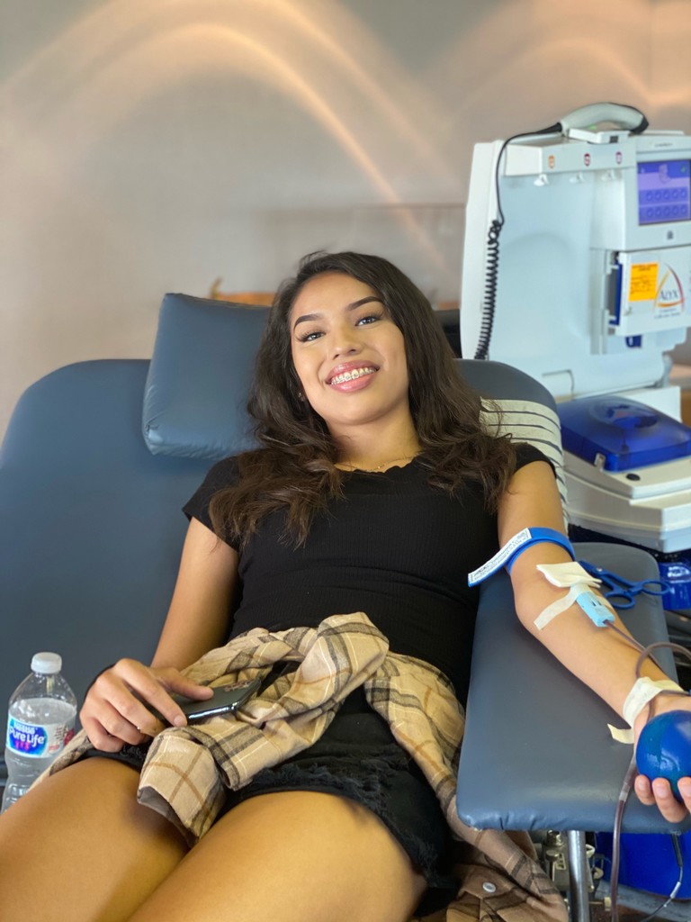 Taylor Grant donating blood.
