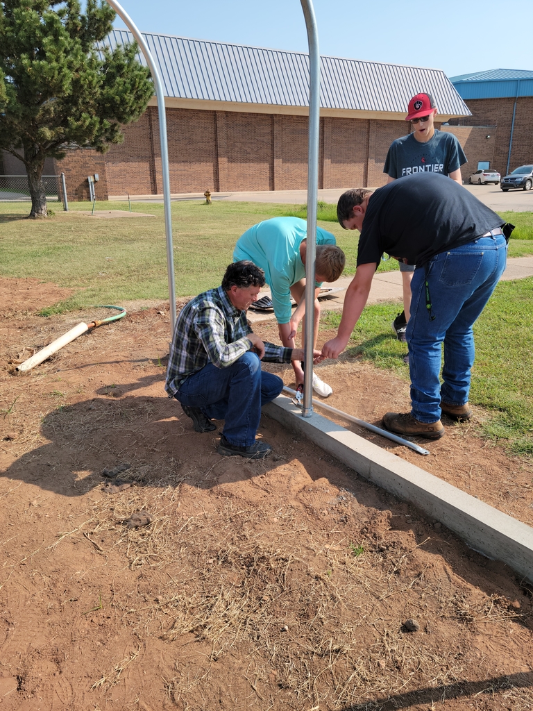 Mr. Hamann and his ag class work on building the new greenhouse